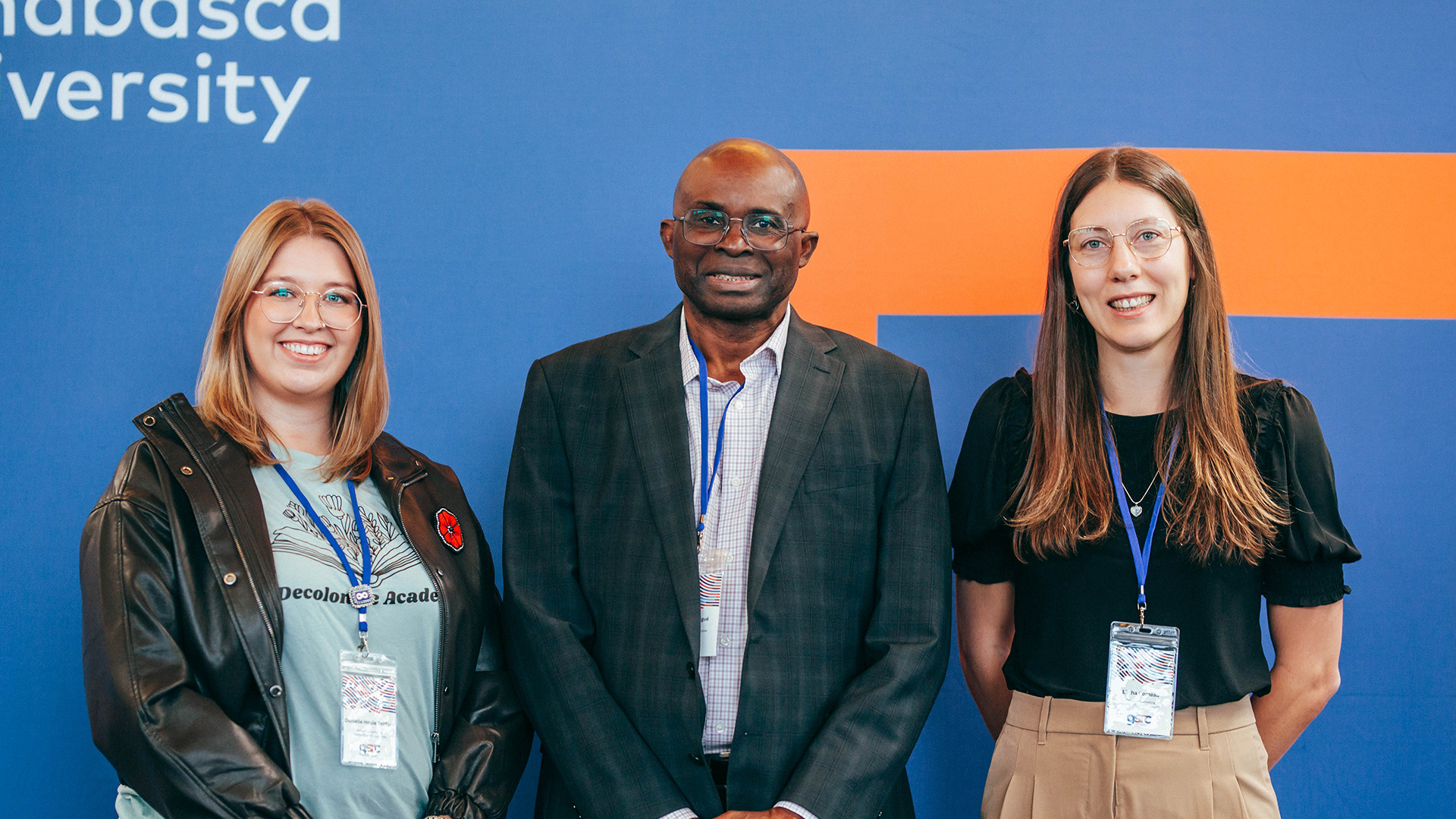 First place winner Elisa Comeau and third place winner Danielle Houle Sanford, GSRC abstract winners stand with interim dean Dr. Simon SIgue
