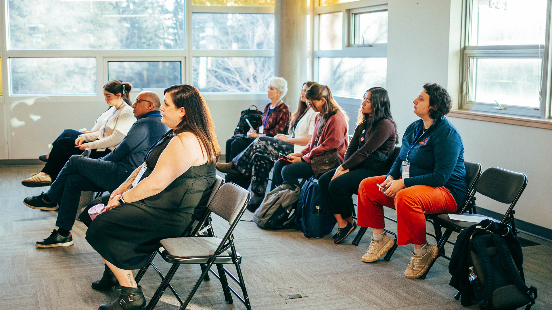 Conference attendees watch a student presentation