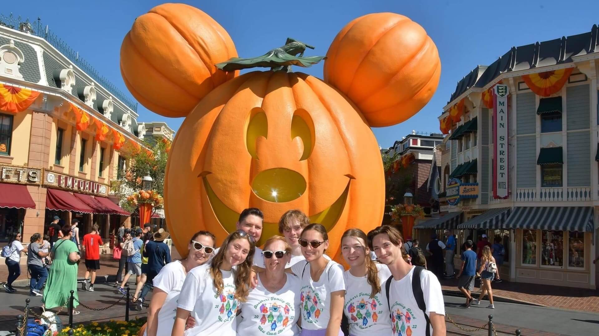 Bueckert family group photo at Disneyland in front of Mickey as a carved pumpkin jack o' lantern Bueckert family group photo at Disneyland in front of Mickey as a carved pumpkin jack o' lantern