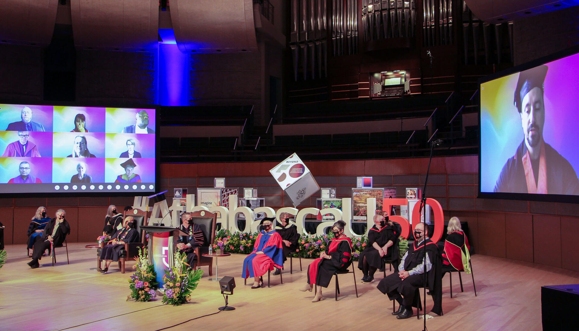 AU convocation in 2020 showing a stage with screens