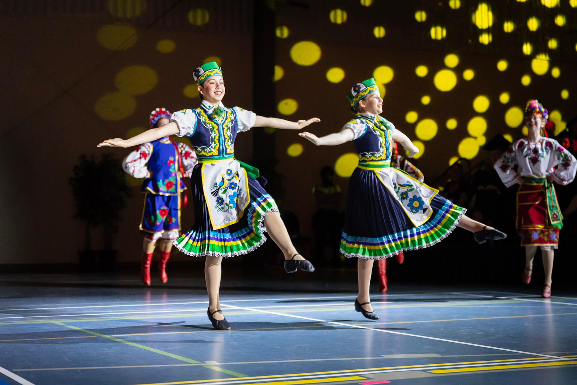 Athabasca Ukrainian Folk Dance Club dancers perform on the convocation stage