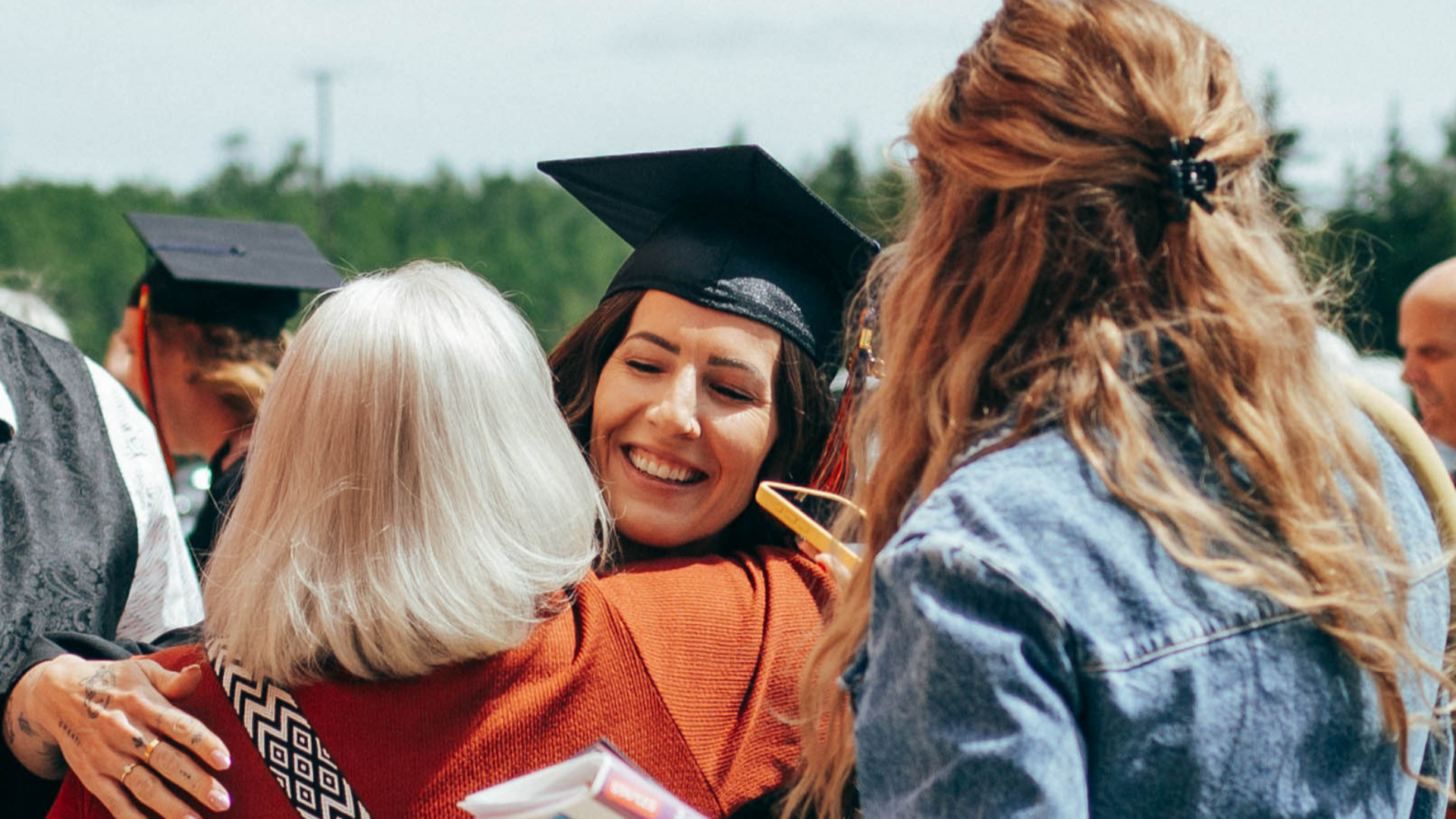 Grad celebrating with family