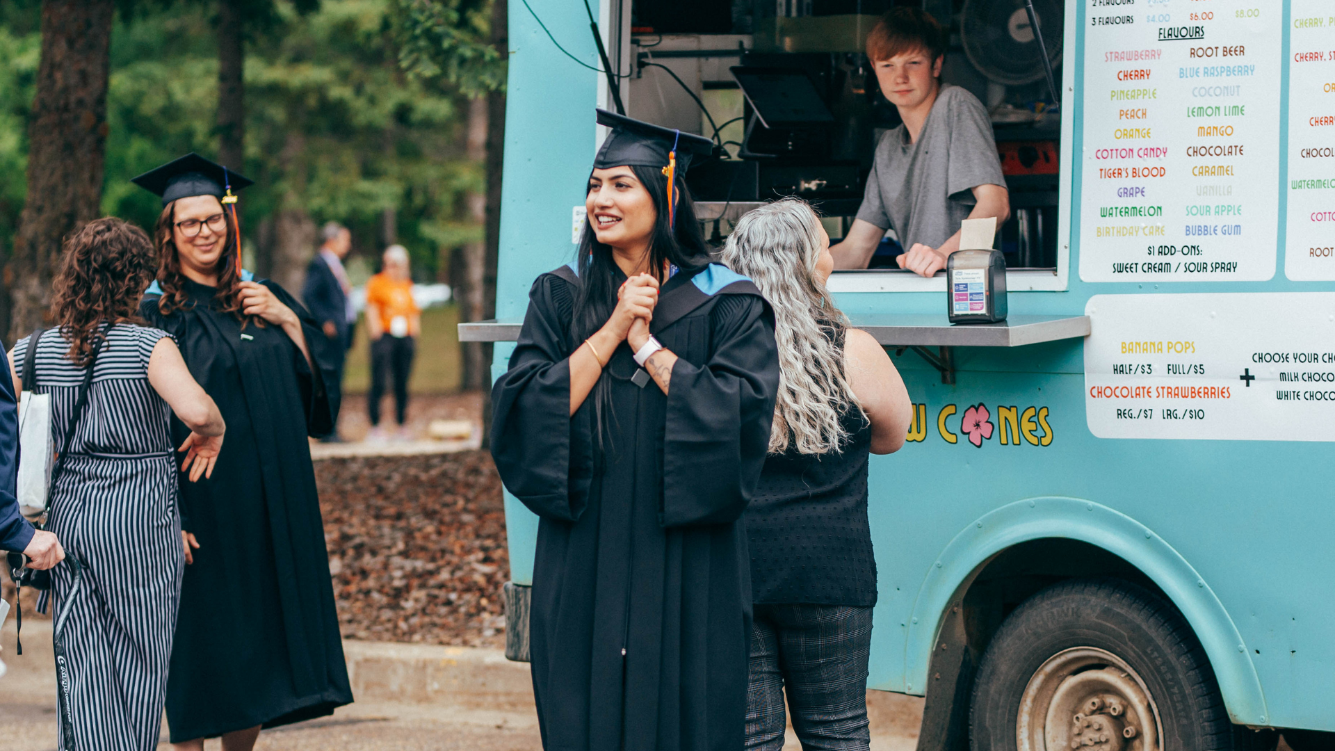 Grad in front of snow cone truck