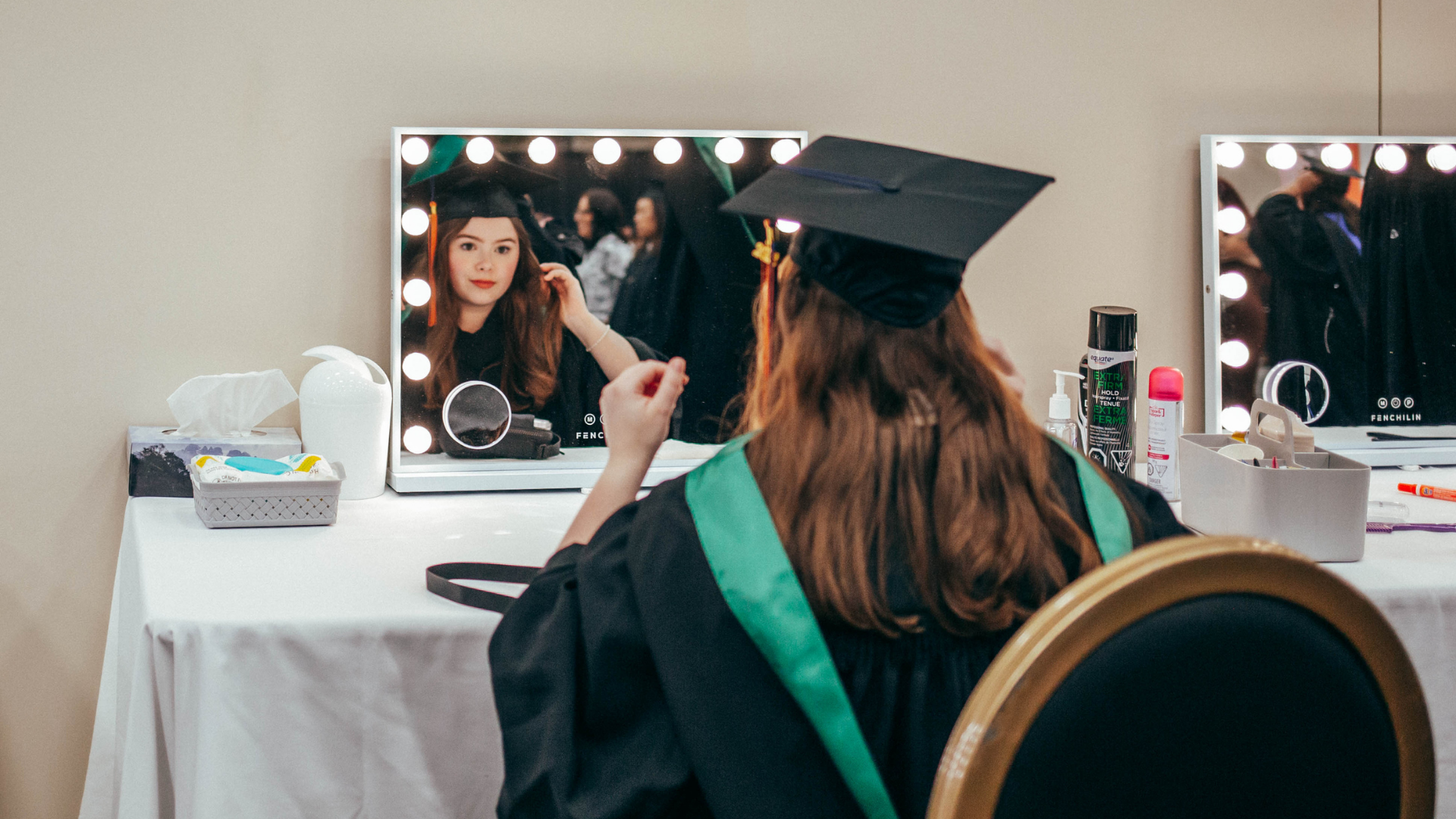 Grad getting ready in mirror