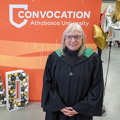Judy Obee wearing convocation robes