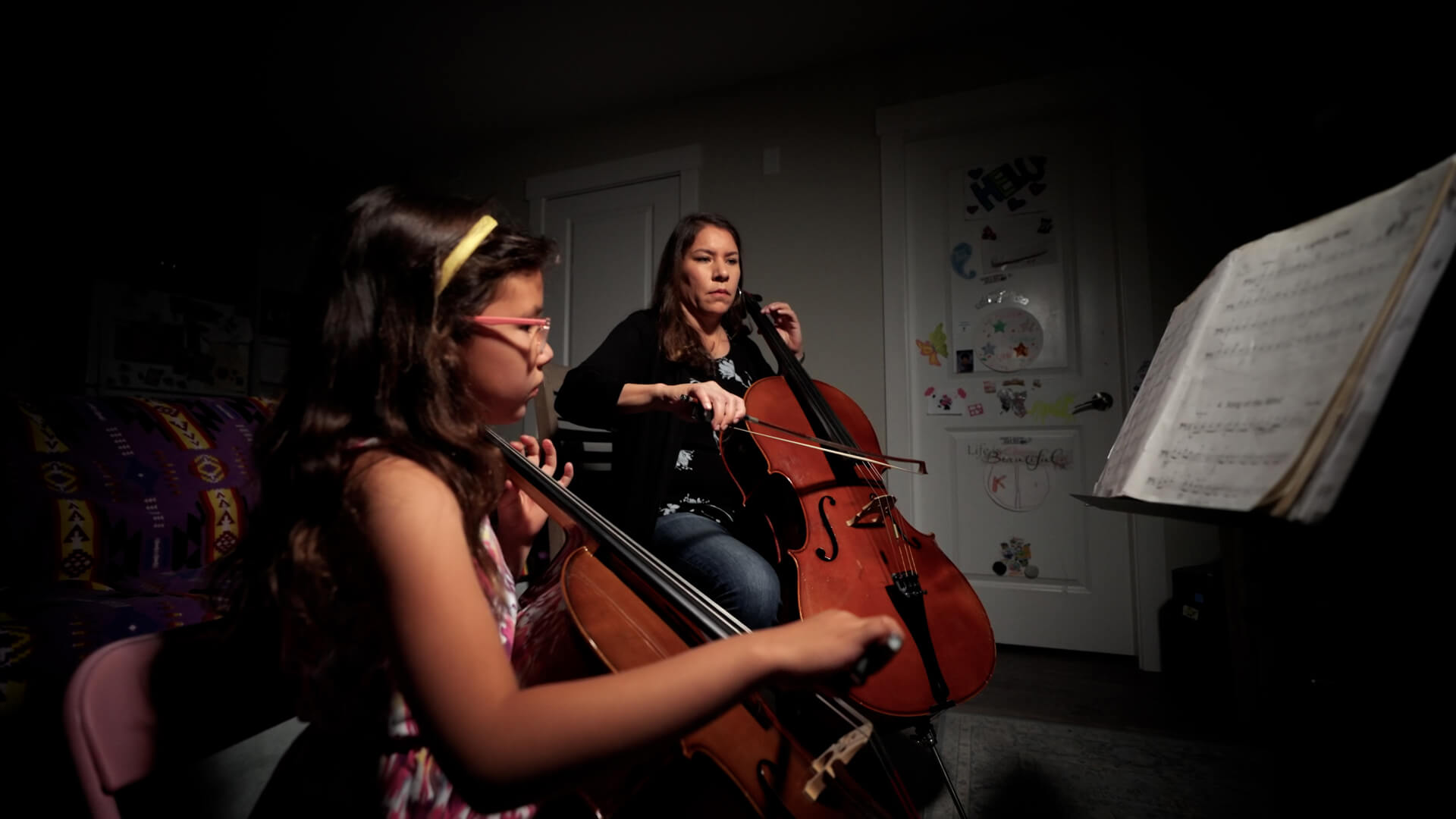 Kethra Stewart and Keira playing cello Kethra Stewart and Keira playing cello