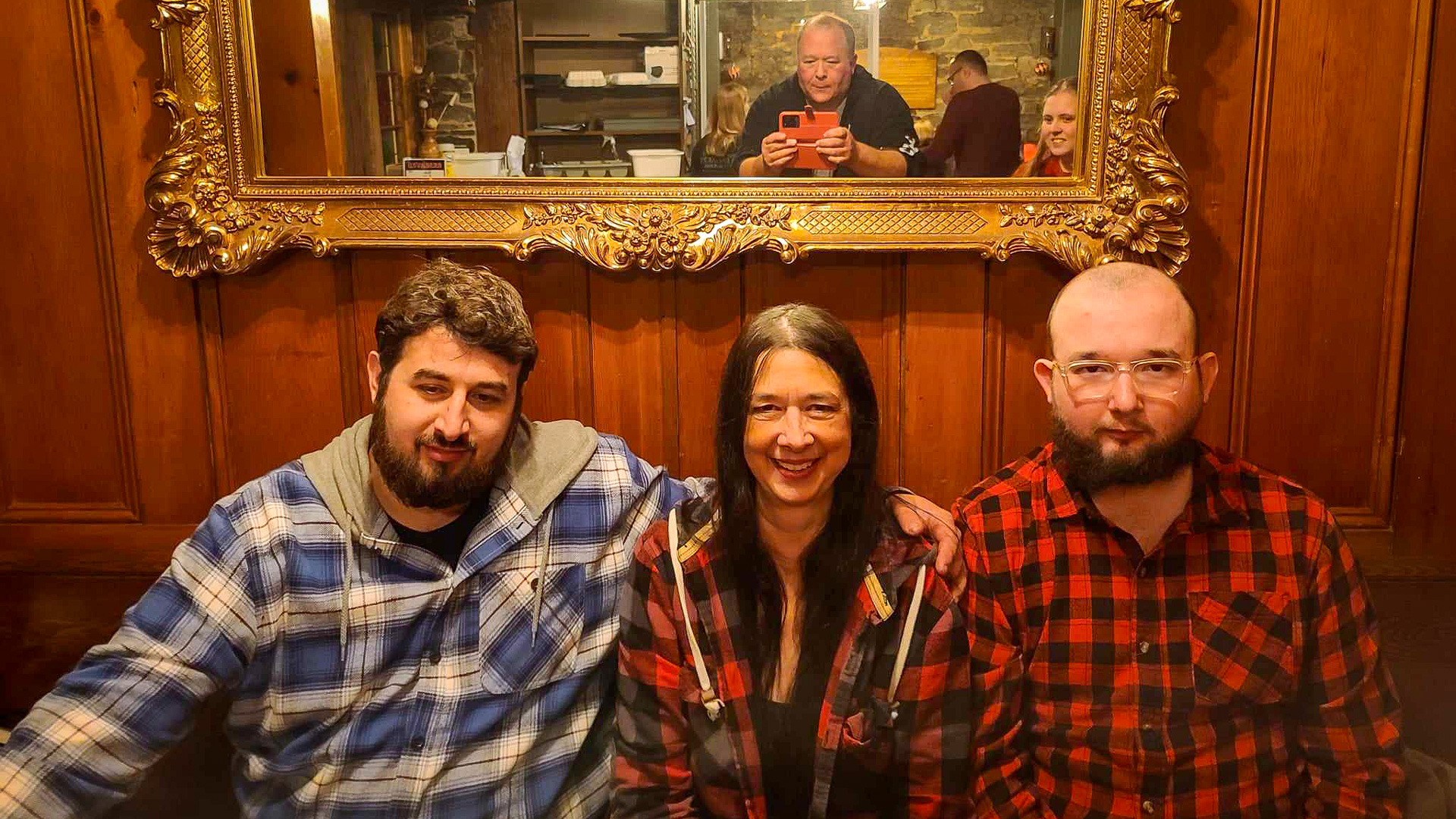 Kimberley Melbourne seated a table with her two boys