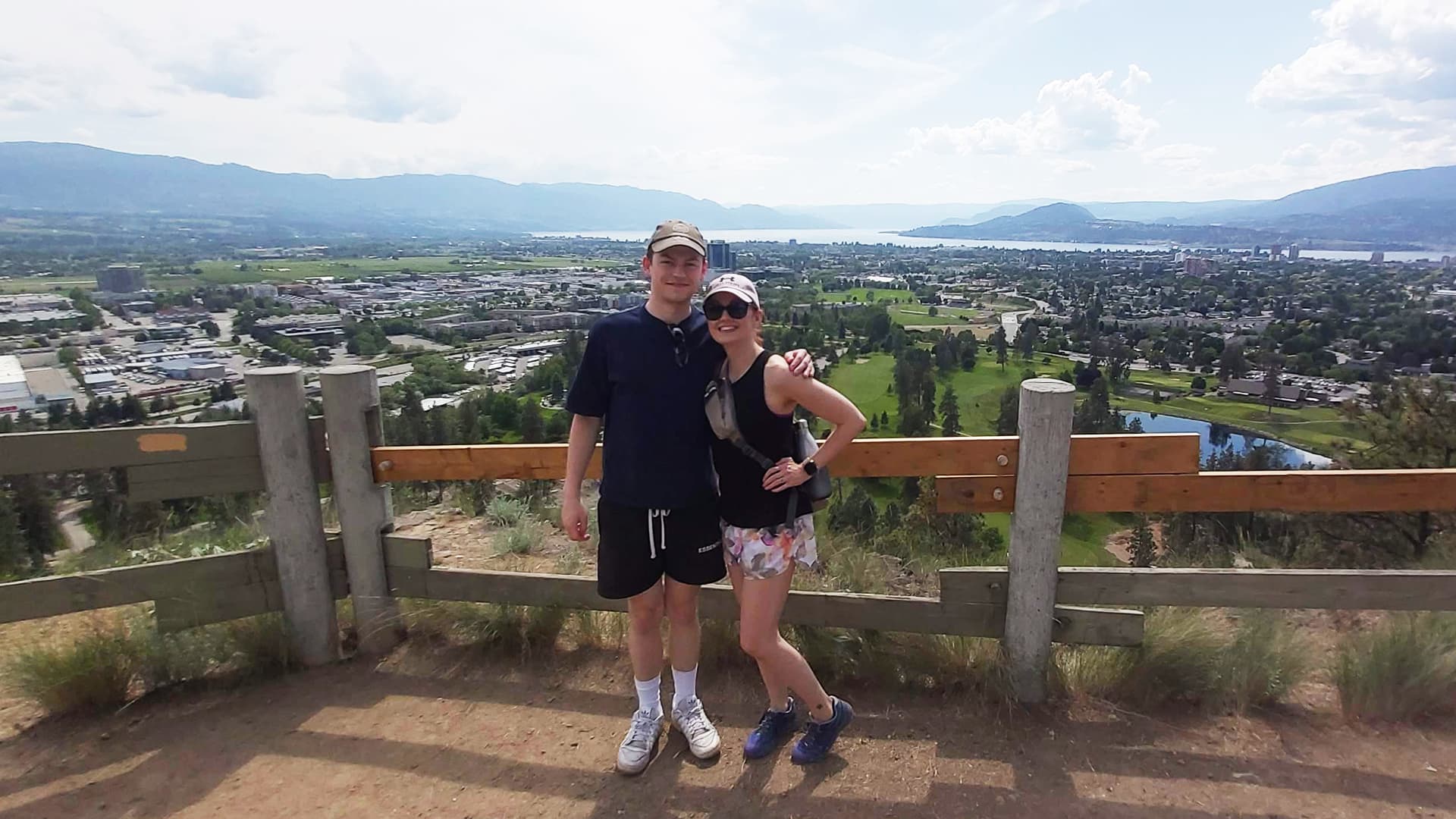Kristen Hovet and her son standing at a viewpoint overlooking the city of Kelowna