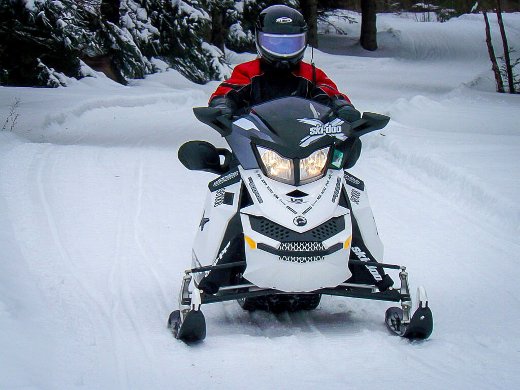 a skidoo running through the snow a skidoo running through the snow