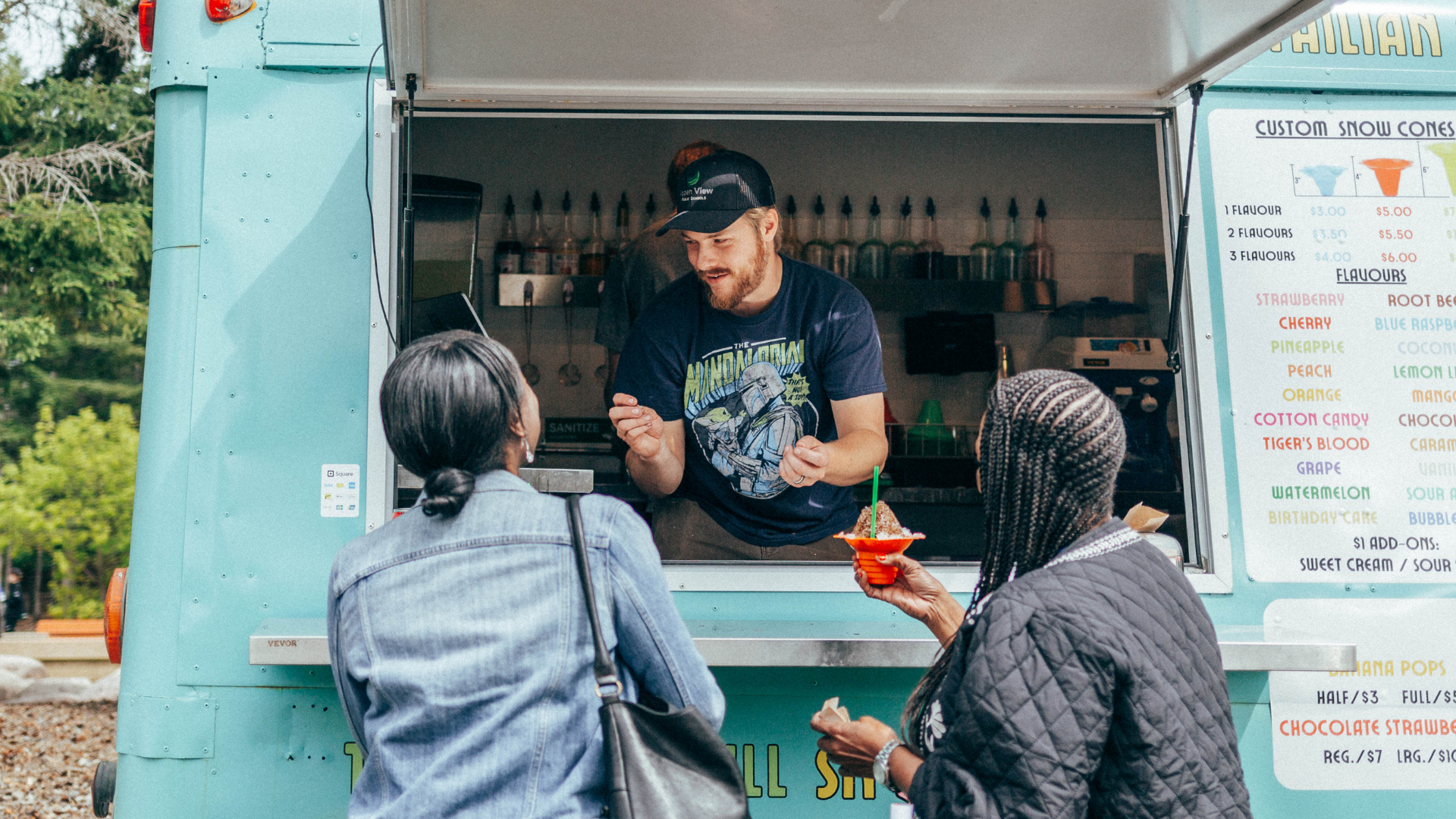 Guests in front of snow cone truck