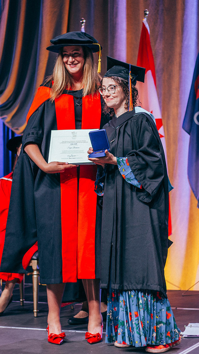 Sofia Barkova stands with Provost Catherine Swindlehurst to accept her goldmedal