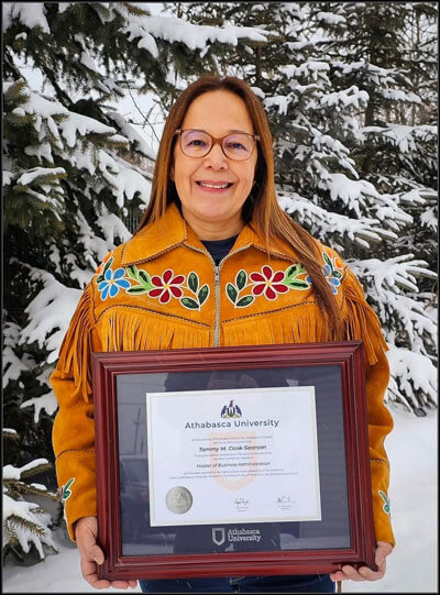 Tammy Cook Searson holding her degree