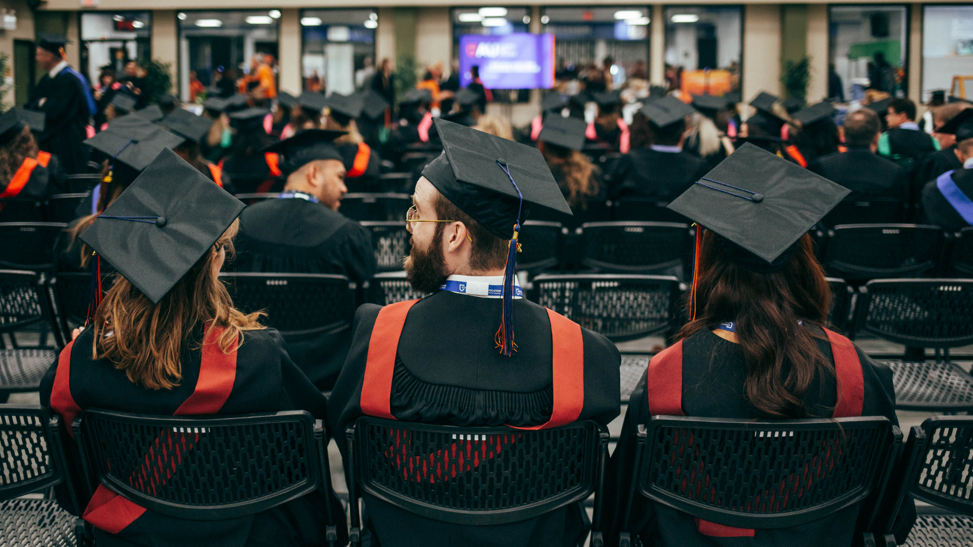 Three grads sitting together