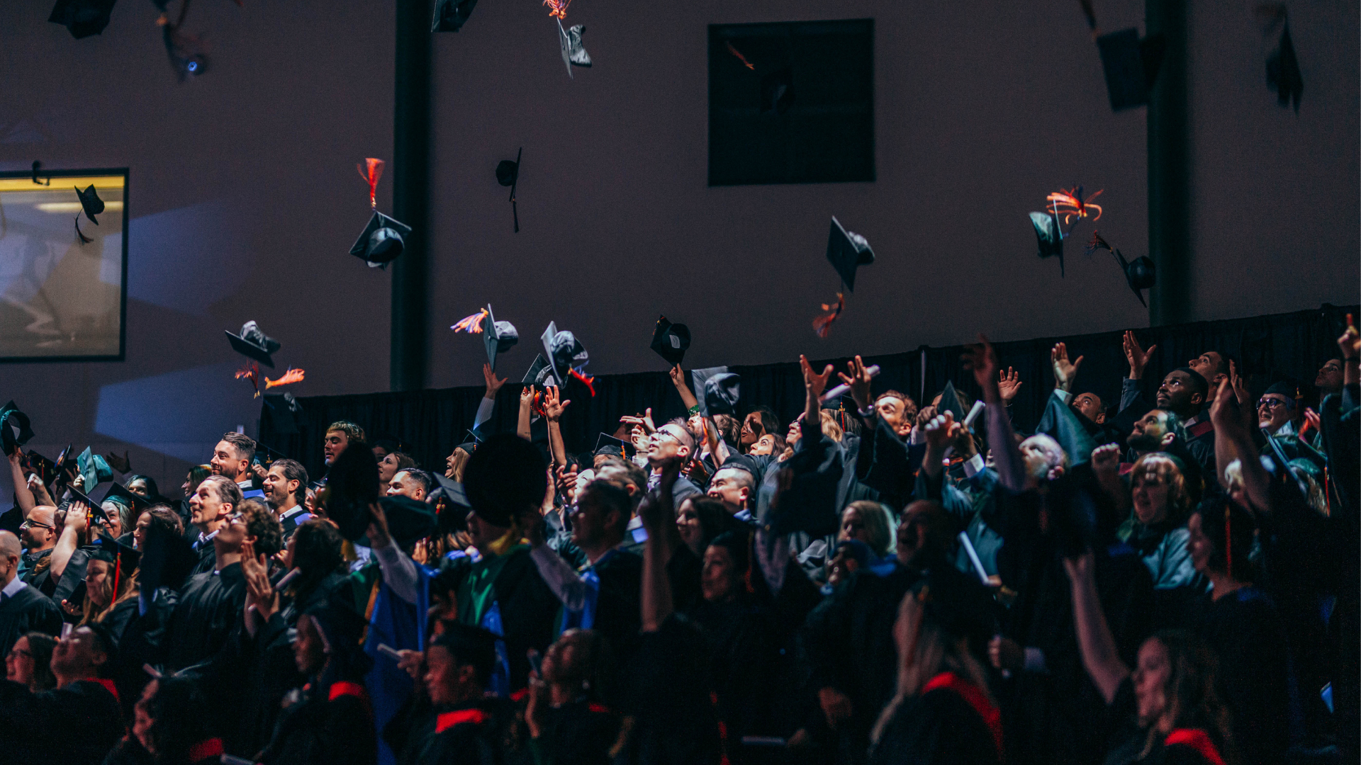 Grads throwing their caps