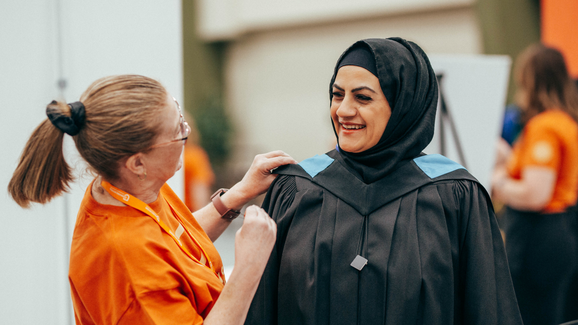 Volunteer helping grad