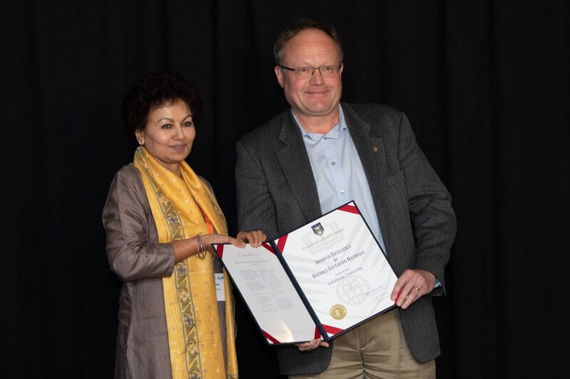 Professor Asha Kanwar (left), President and CEO of the Commonwealth of Learning, presented Athabasca University Professer Dr. Dietmar Kennepohl, with the Award of Excellence for Open and Distance Education Materials at the Pan-Commonwealth Forum held in Edinburgh, Scotland, Sept. 9-12, 2019.