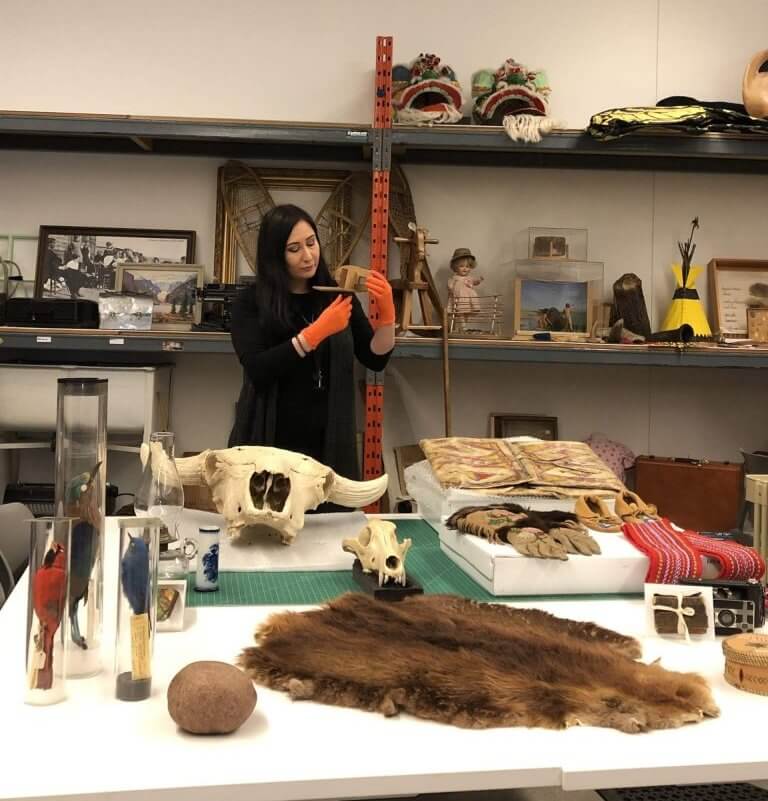 Eleonora Sermoneta surrouded by artifacts at the Royal Albert Museum