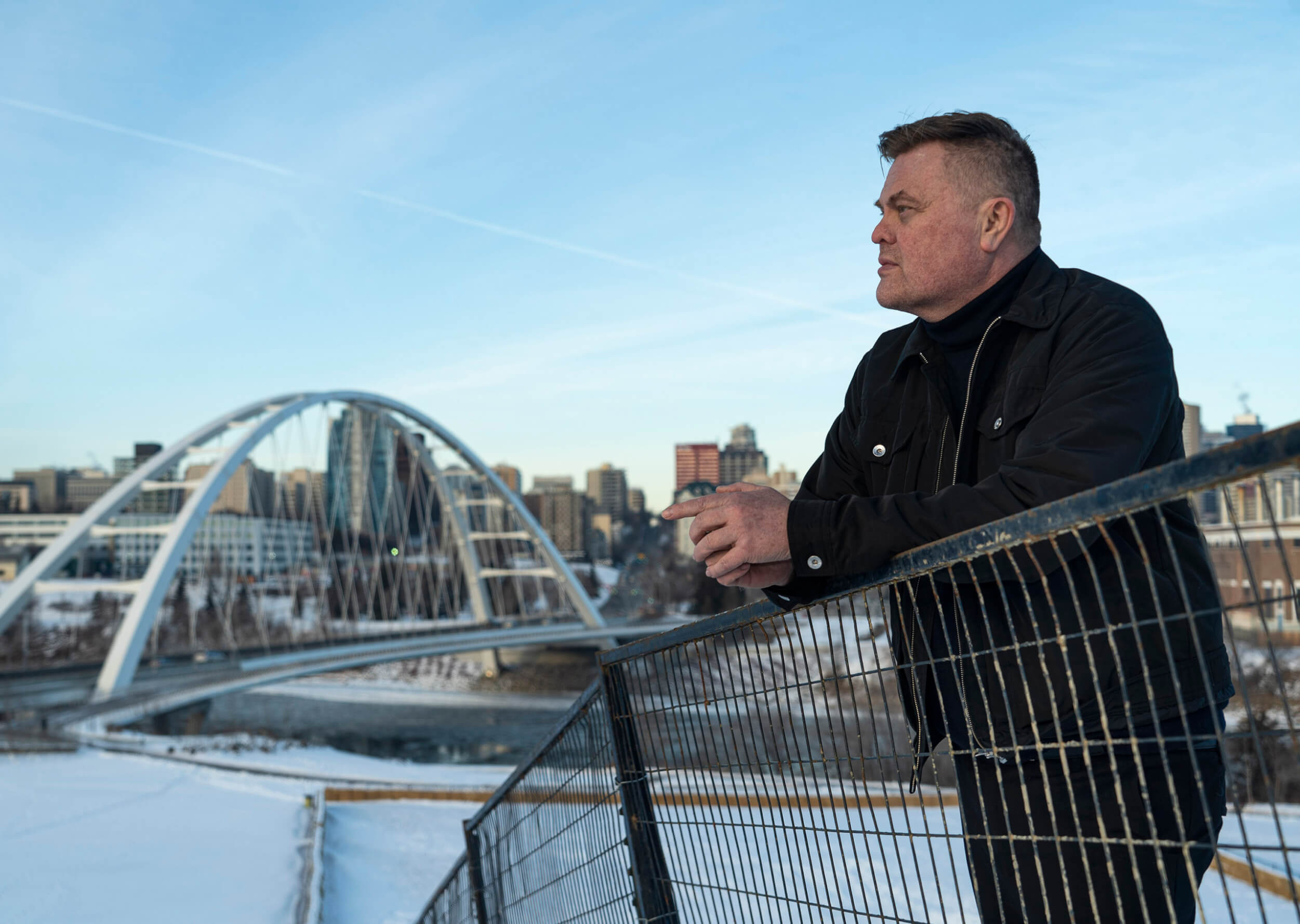 Dr. Wayne Clark with a view of the Walter Dale Bridge in Edmonton in winter