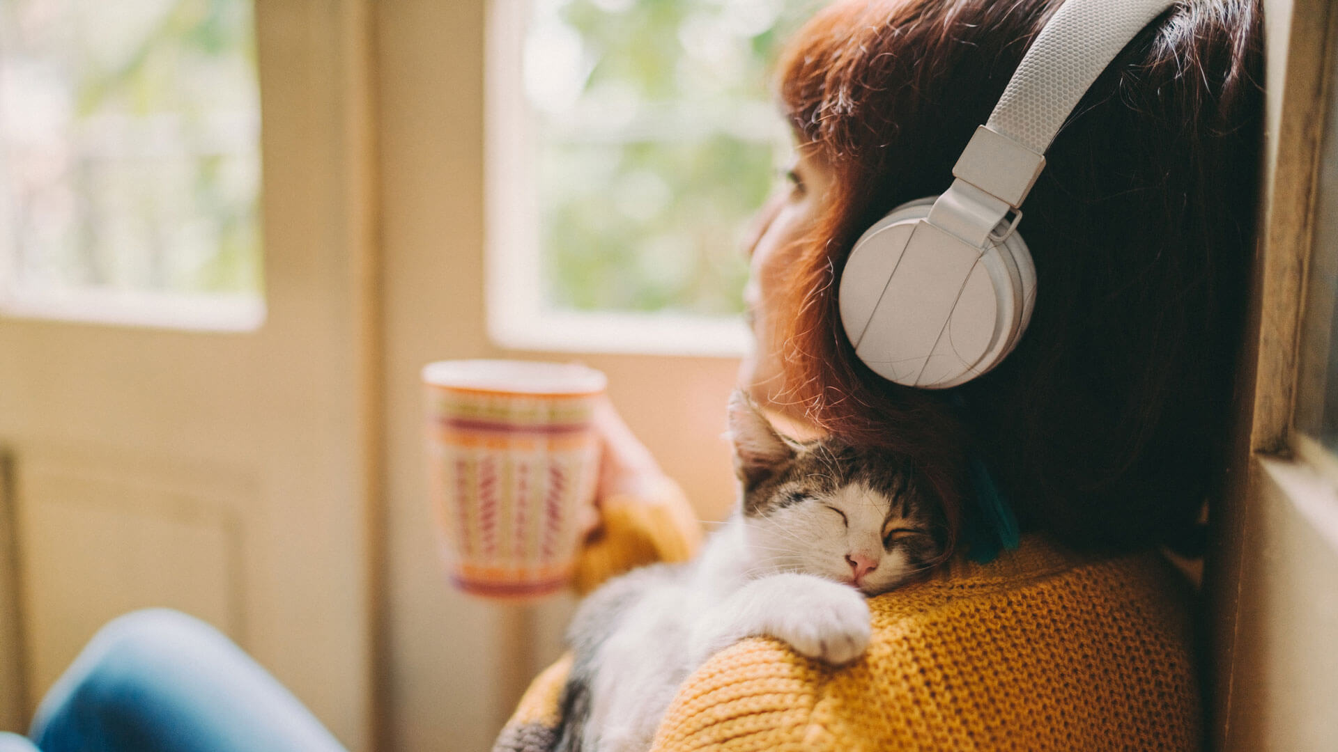 person listening to music with headphones
