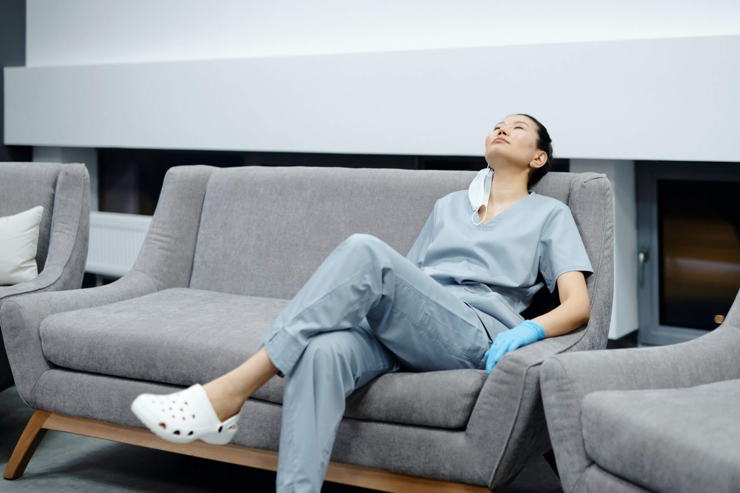 Exhausted nurse sitting on a couch