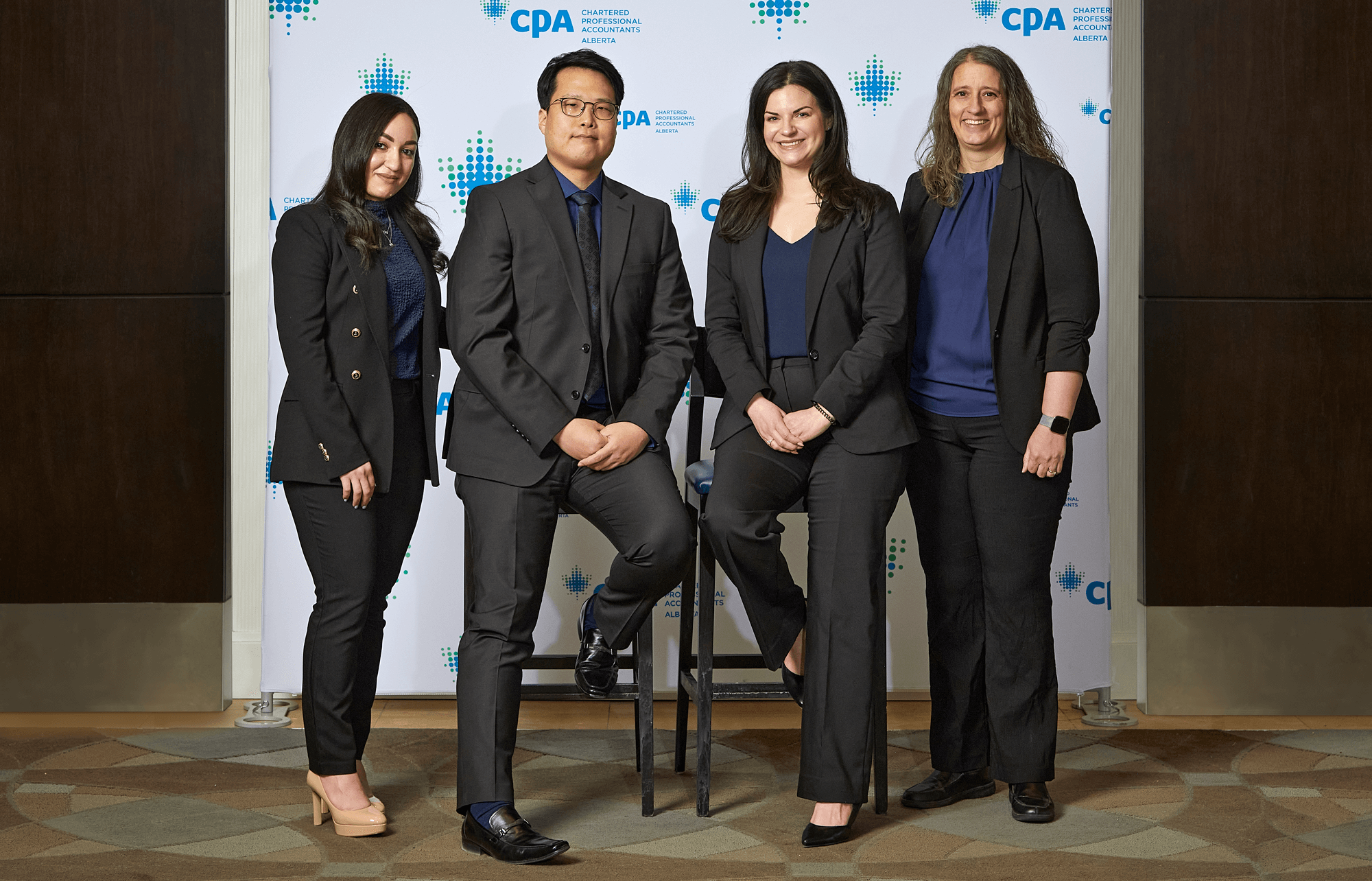 4 Athabasca University business students pose for the camera after competing at a business case competition