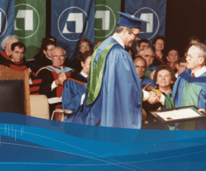 An Athabasca University graduate receives their parchment at convocation in the mid-1980s
