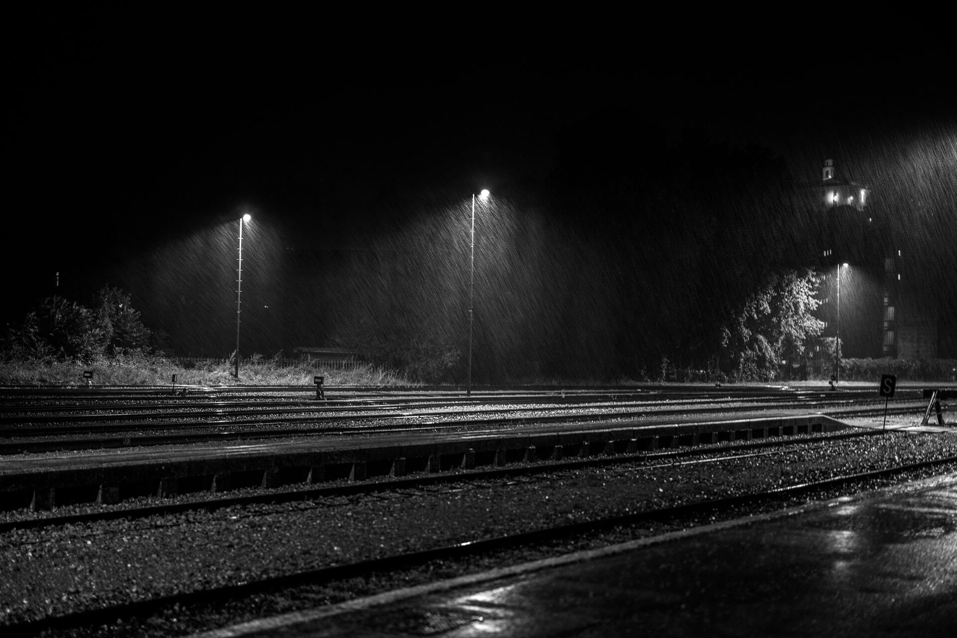urban train tracks at night