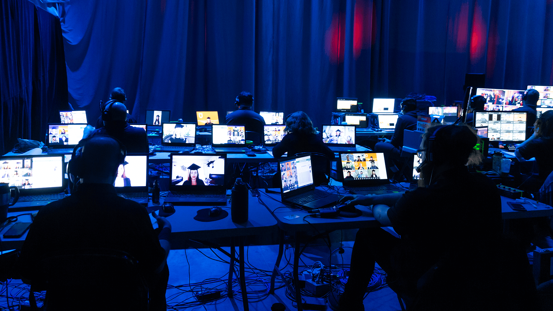 backstage of the convocation ceremonies. dark photo with many computer screens