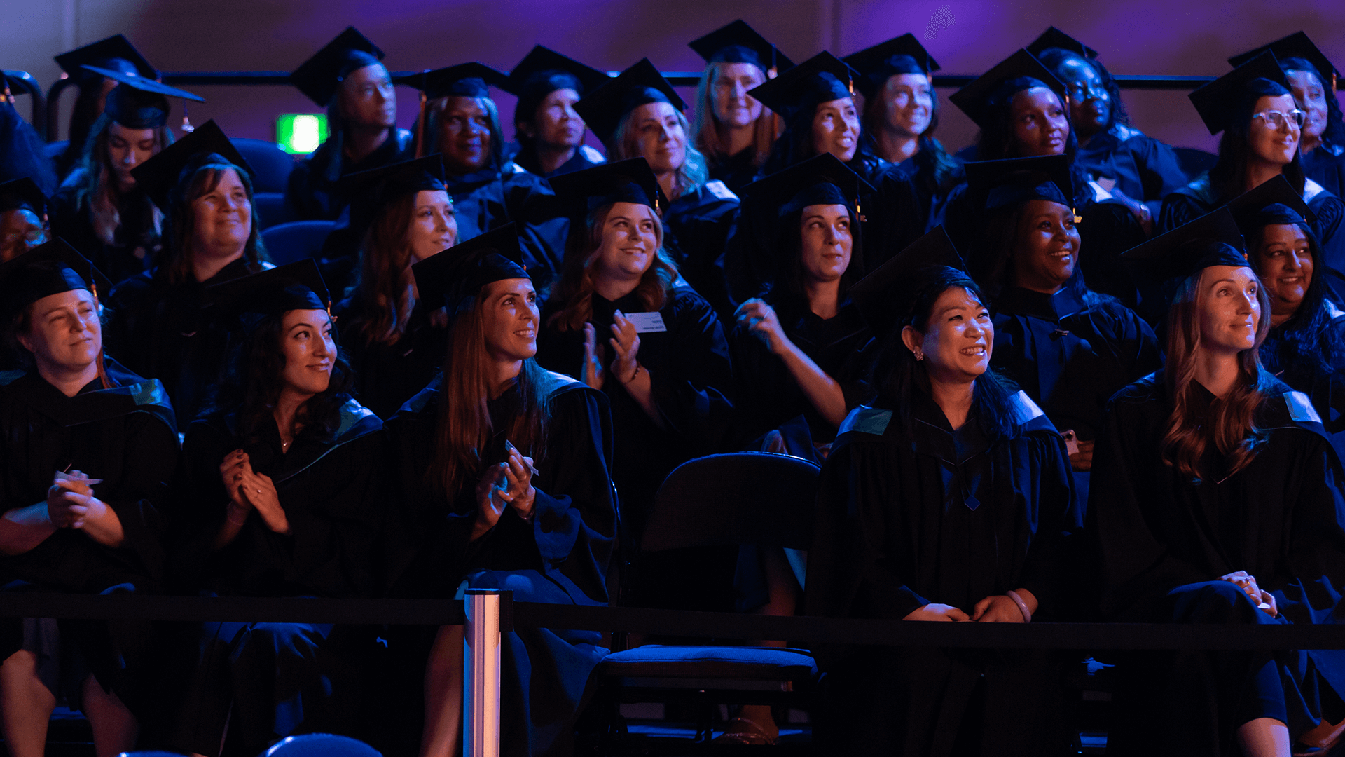 crowd shot of a group of graduates during the ceremony