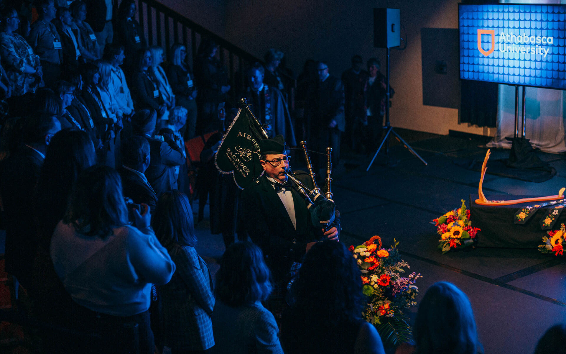 A bag pipe player leads a procession to mark the installation of Dr. Alex Clark as AU's 11th president.