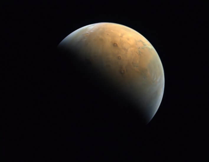 Mars a crisp picture of a planet (Mars) with red hues in front of a black sky