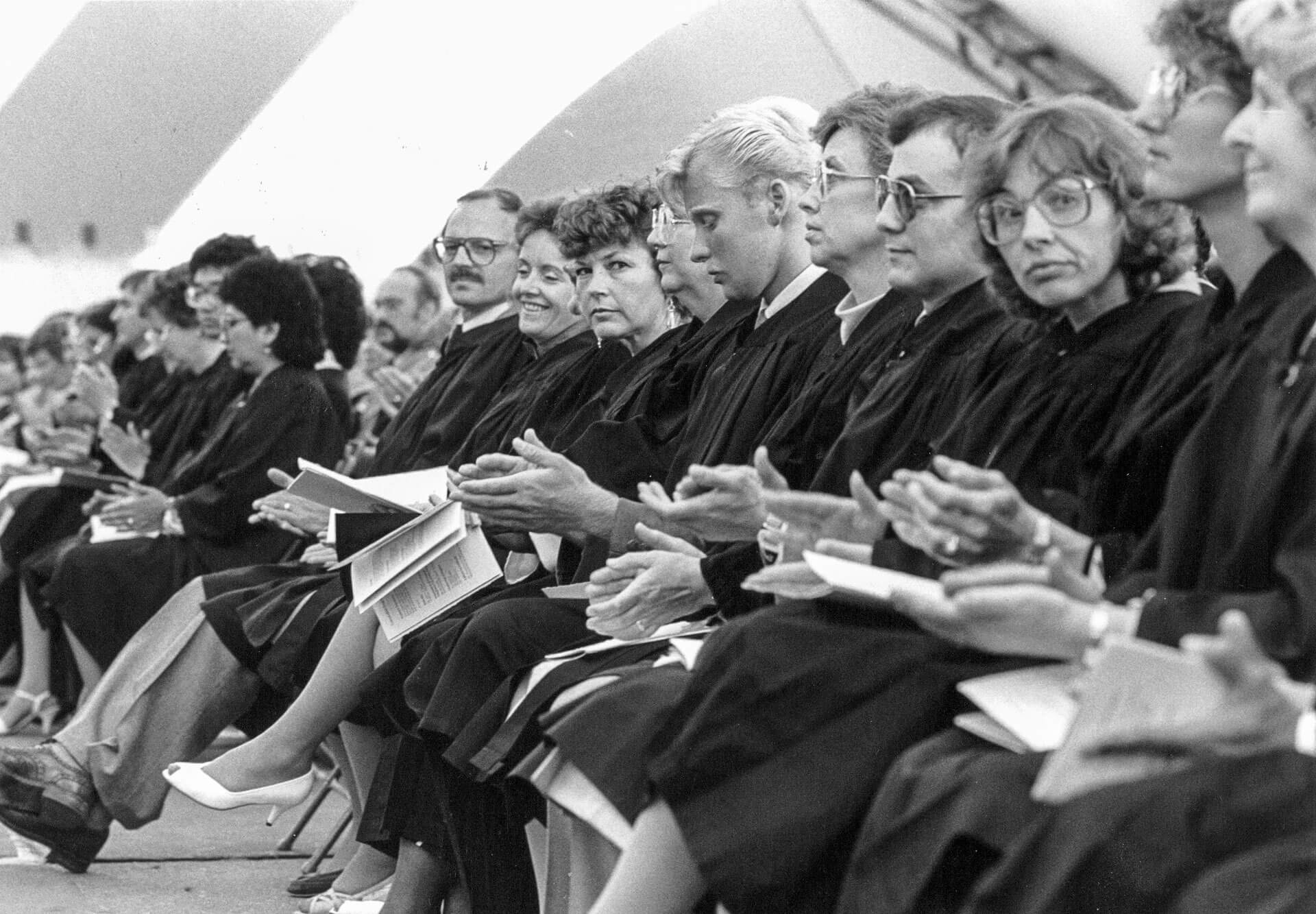 1991.056.12857_0073 vintage photo of graduates seated in gowns at convocation