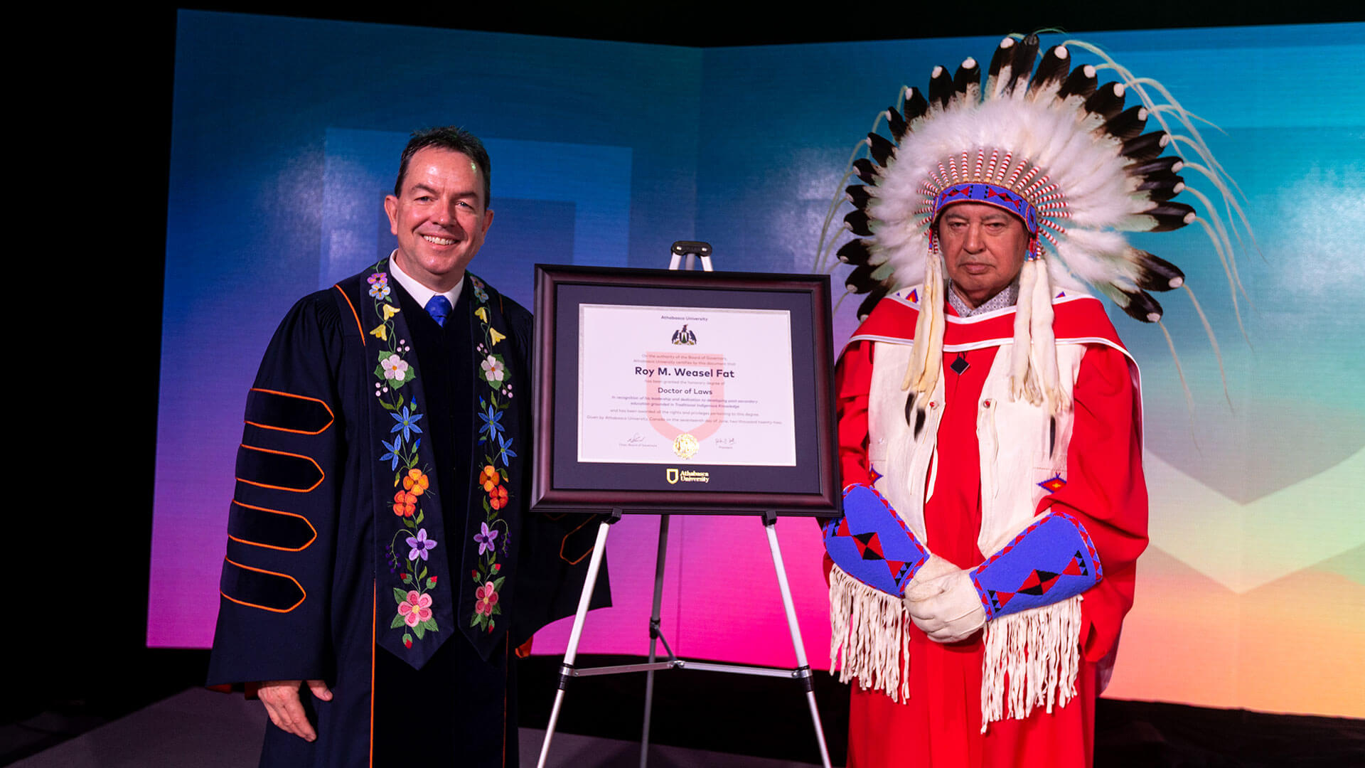 20220517_AthabascaU_Convocation_114 Peter Scott with Roy Weasel Fat, who is wearing a headdress