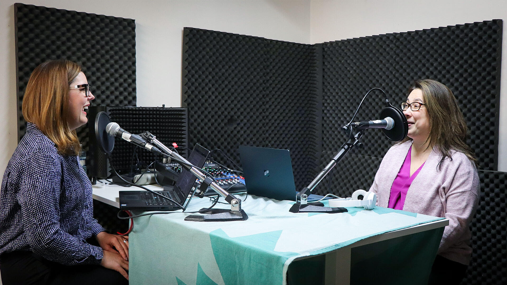 IMG_2654 two women at a podcast recording in front of microphones