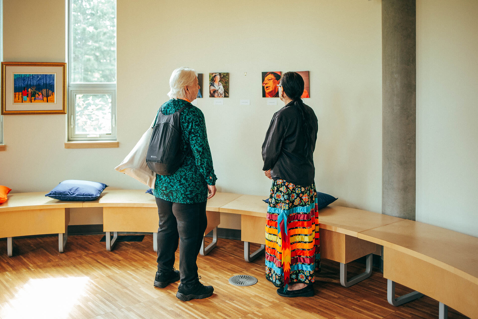 athabascauniversity0O0A0620June 17 2023 two people view artwork in Bertha Clark-Jones O.C. Art Gallery
