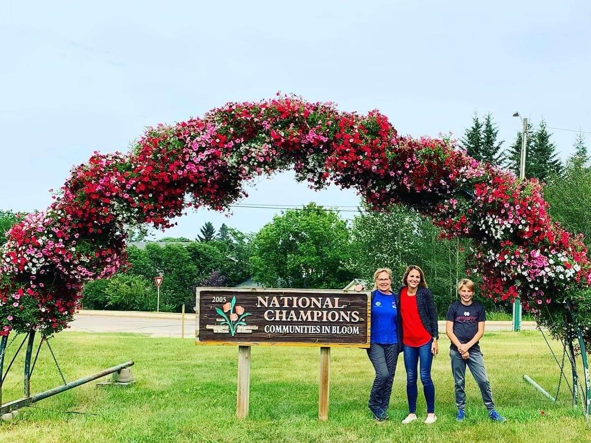 Meggan Franks in front of Athabasca sign
