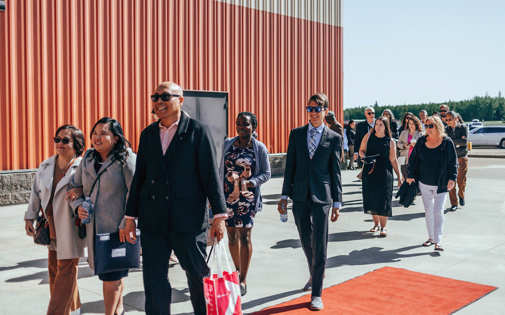 Arrival Group of people walking in Athabasca University convocation