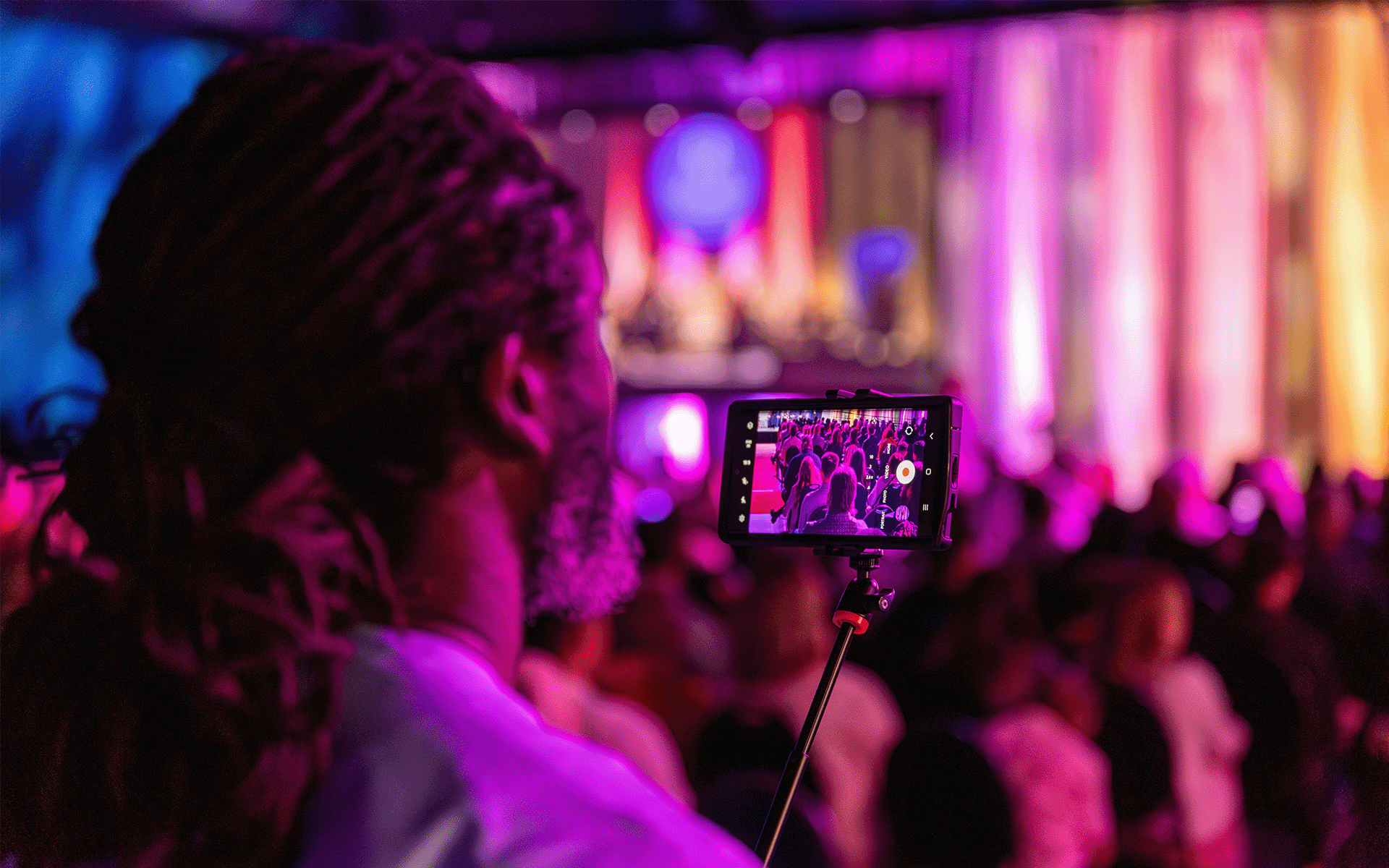 Family recording Person watching the ceremony and recording on their phone